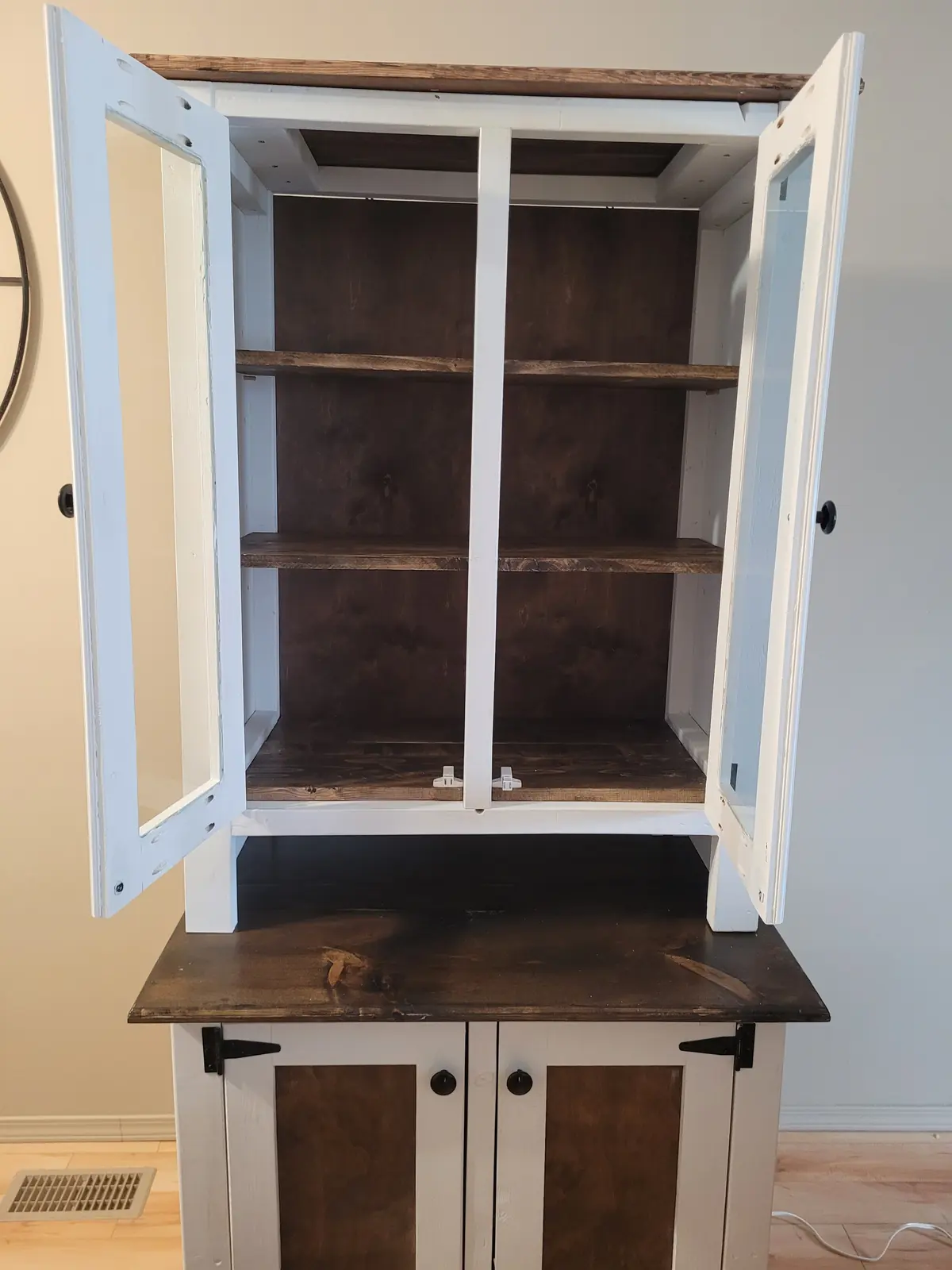 Custom hutch with open glass doors and stained shelves