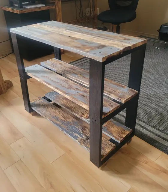Open rustic shelf unit with black frame and torched plank shelves