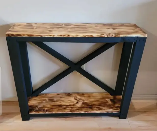 Black rustic console table with X brace and torched wood top