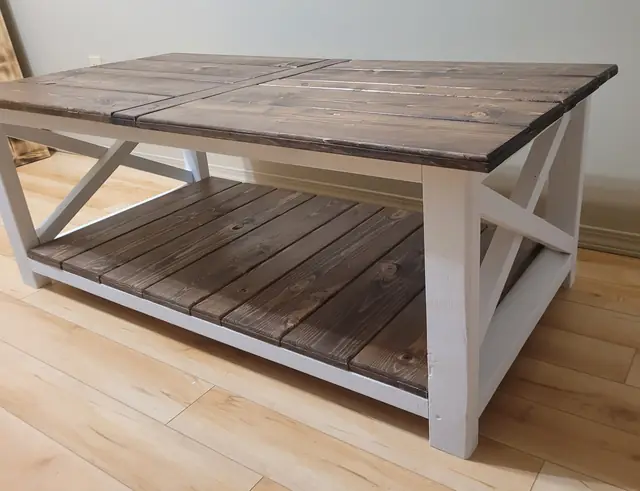 Farmhouse coffee table with stained top, white X sides and plank lower shelf