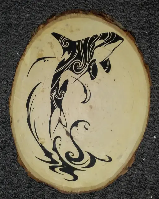 Orca decoupage on a live-edge wood slice