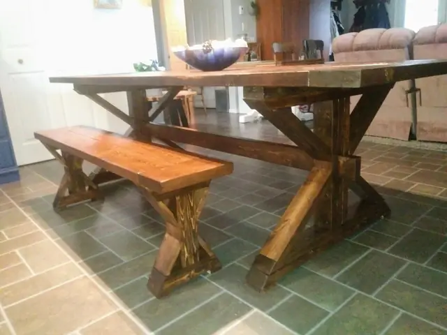 Hand-built farmhouse trestle dining table with matching bench, made in Prince George BC