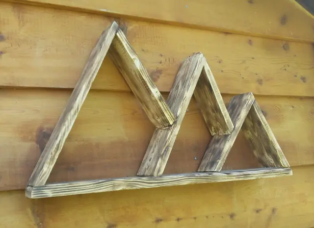 Mountain-range wall shelf in weathered rustic wood