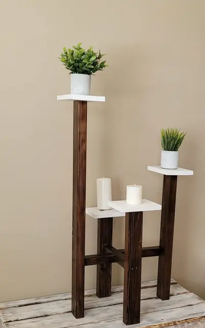 Tall rustic plant stand with white tiers and dark wood posts